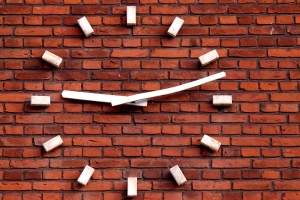 clock_on_a_red_brick_wall